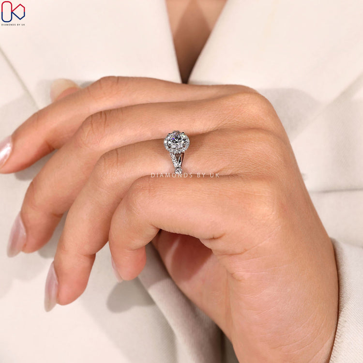 Lab grown round ring with halo and pavé style.
