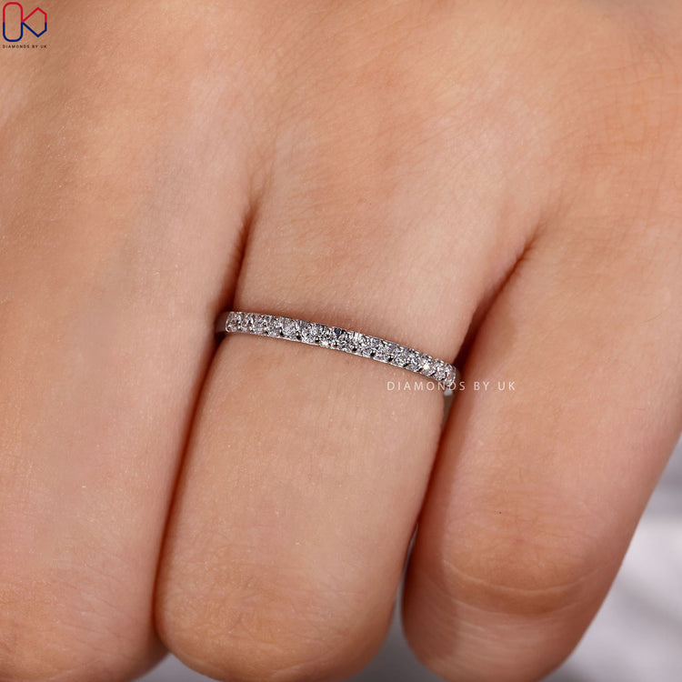 Round diamond band with a classic prong setting.