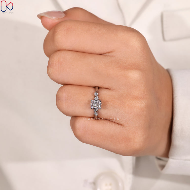 Five stone cushion ring with four claw prongs.
