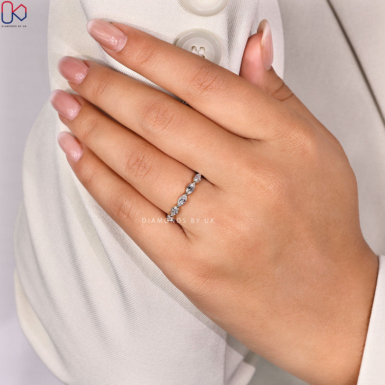 Shared prong marquise diamond wedding band.