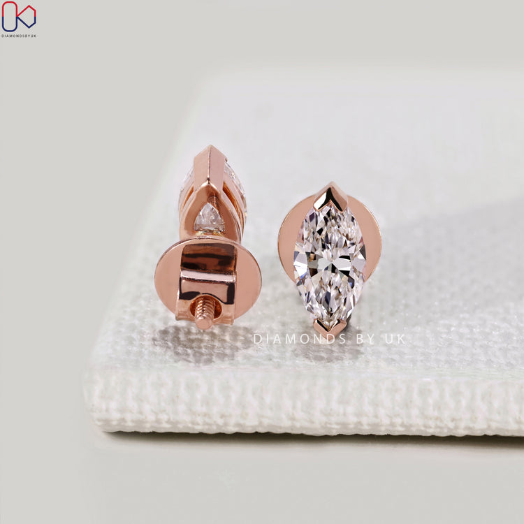 Handmade marquise diamond stud earrings by Diamondsbyuk.