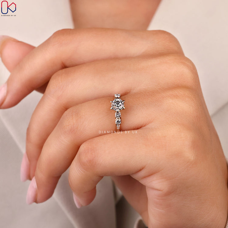 Lab grown round cut ring with side diamonds.