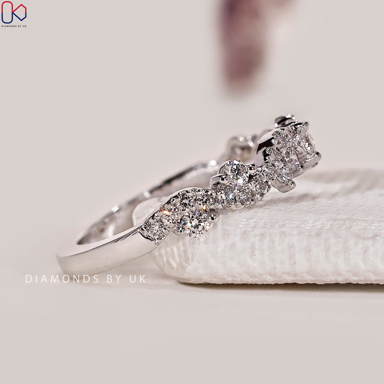 Round cut lab grown diamond band with twisted pavé.
