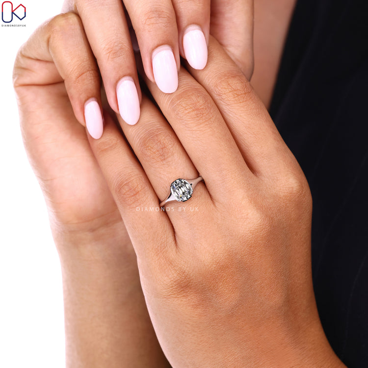 Cushion Old European cut ring with solitaire setting.
