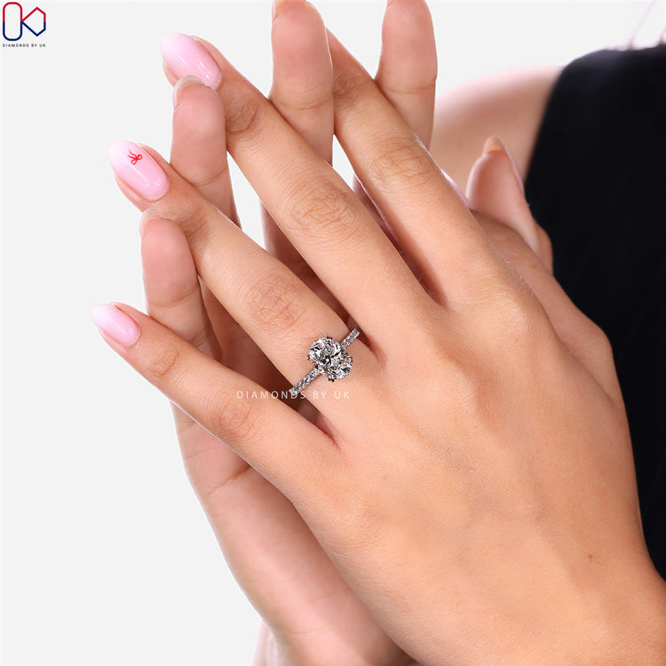 Diamondsbyuk oval engagement ring with round pavé.
