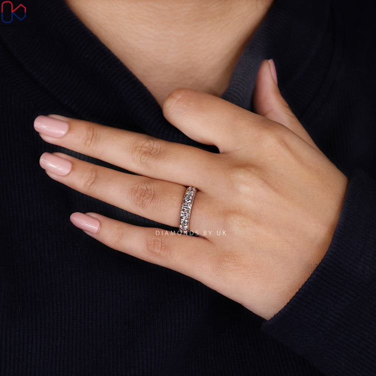 Lab grown round diamond band with three sided eternity.
