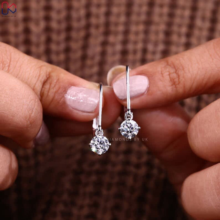 Handmade round diamond earrings with drop design.
