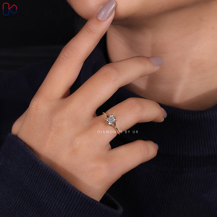 Handmade cushion cut solitaire engagement ring.