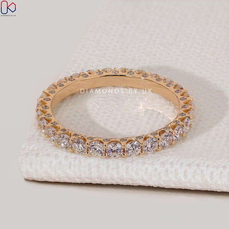 Lab grown round diamond wedding band with eternity style.
