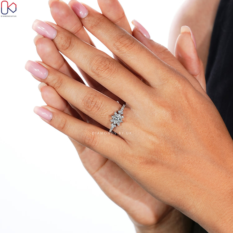 Princess cut ring with pavé style and compass prongs.
