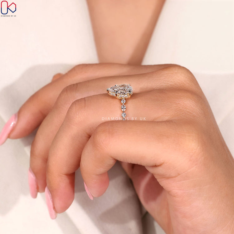 Lab grown pear ring with five claw prongs.