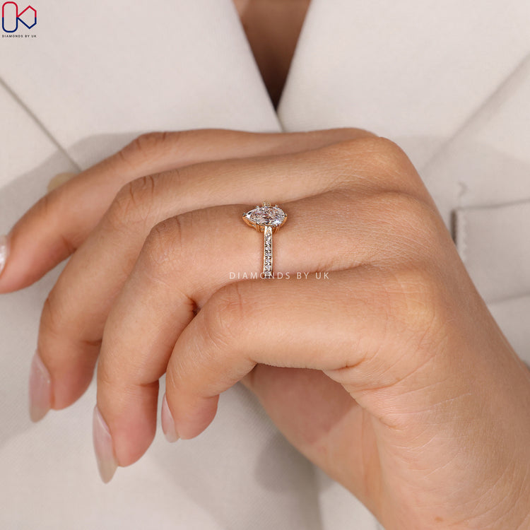 Pear cut ring with heart prong setting, handmade.