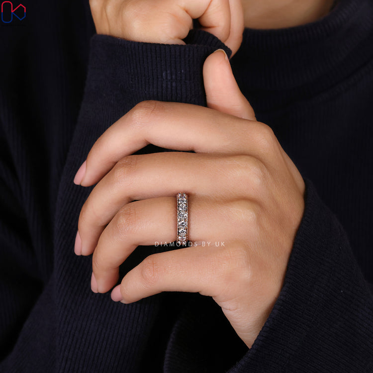 Handmade round diamond wedding band in full eternity style.
