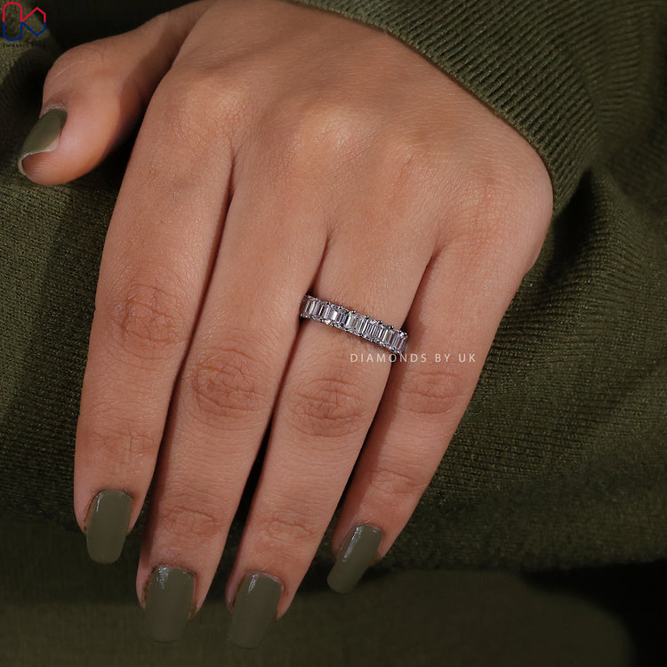 Emerald cut diamond band with classic prong setting.
