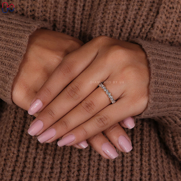 Yellow gold wedding band crafted with alternating marquise and round lab diamonds.
