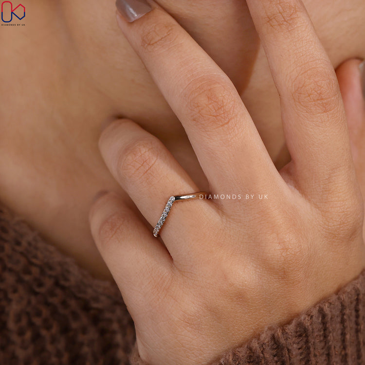 Round cut diamond chevron band with V shaped setting.
