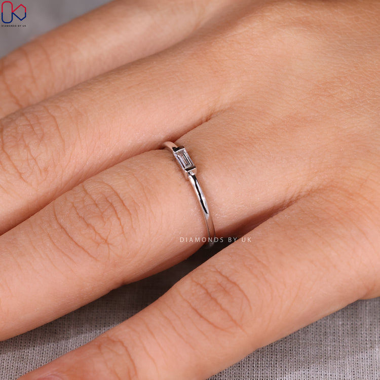 Handmade baguette wedding band with half bezel style.
