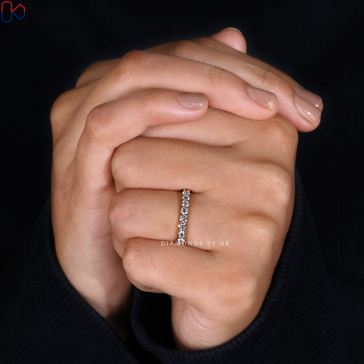 Round cut diamond wedding band in full eternity style.
