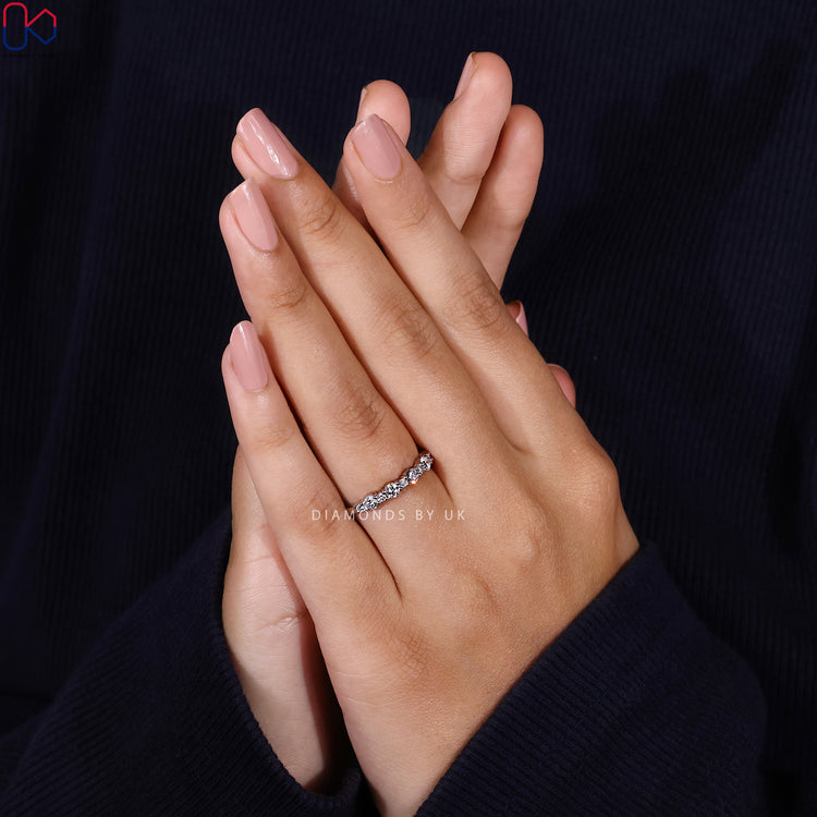 Lab grown round cut wedding band with prong setting.
