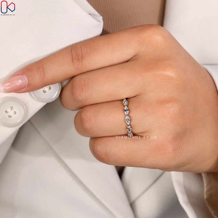 Handmade wedding band with marquise diamond pavé.