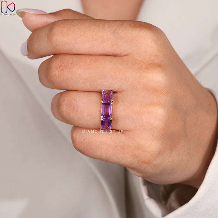 Handmade jewelry with emerald cut amethyst and round diamonds