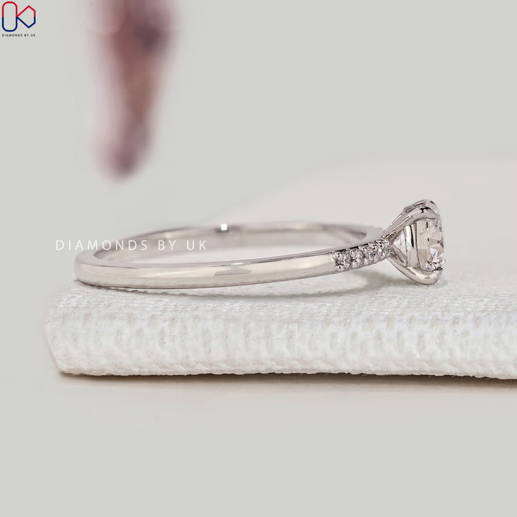 Lab grown round cut diamond ring with claw prong setting.
