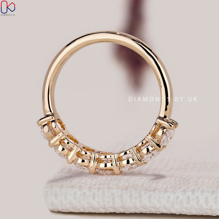 IGI certified oval diamond band with prong setting.
