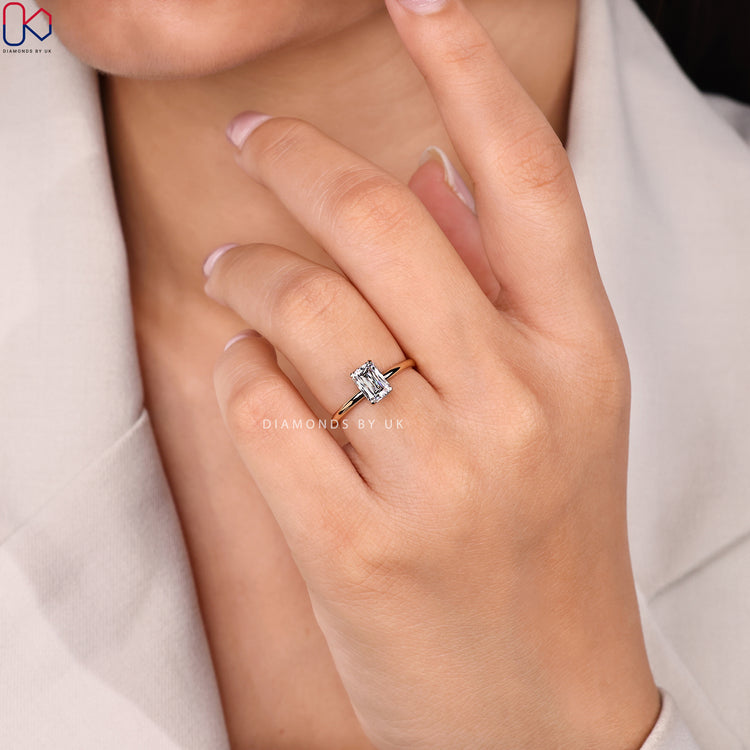 Criss cut solitaire ring with secure tab prongs.