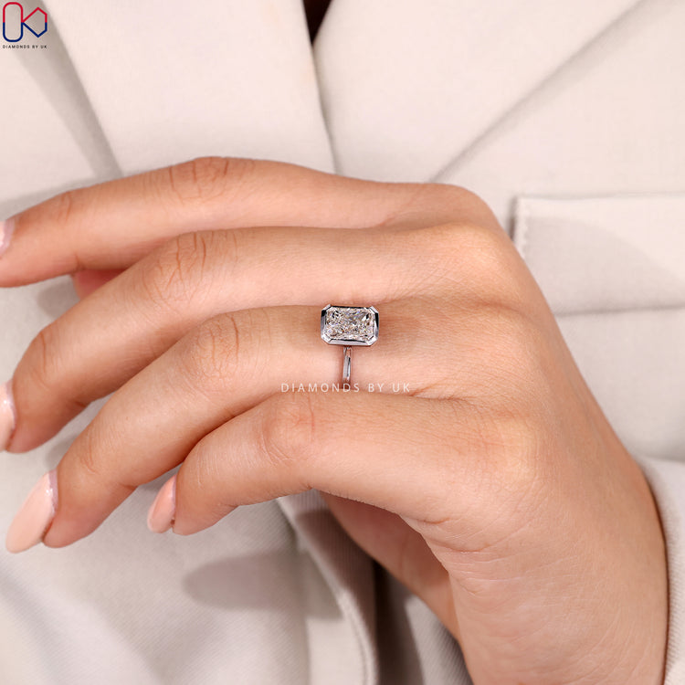 Lab grown radiant ring with cathedral setting.