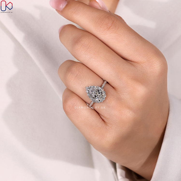 Pear engagement ring with three claw prong setting.