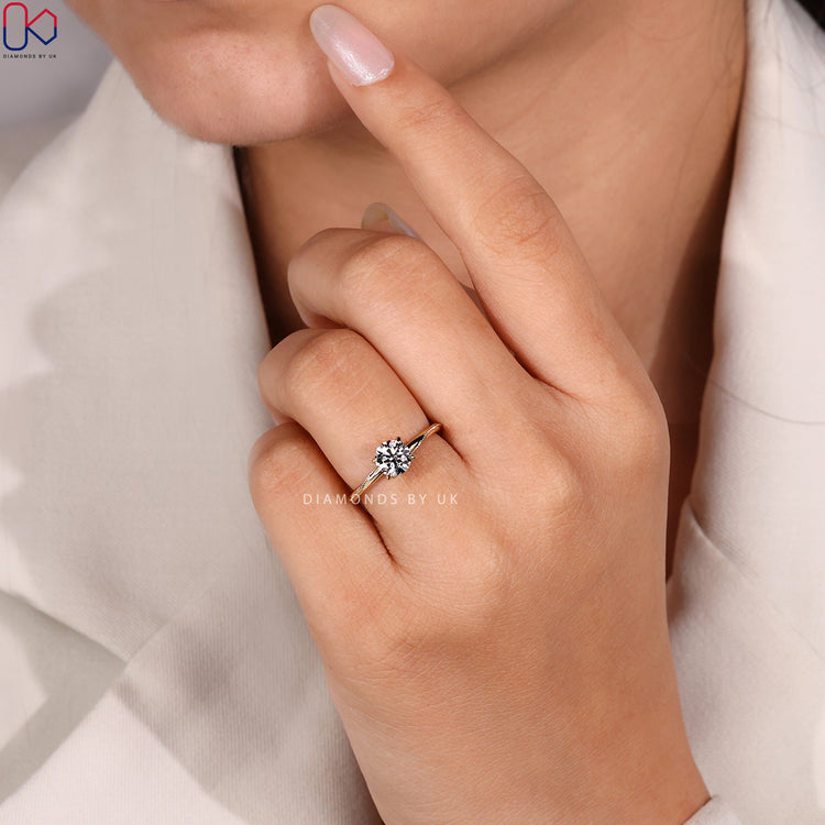 Round cut diamond ring with hidden stones
