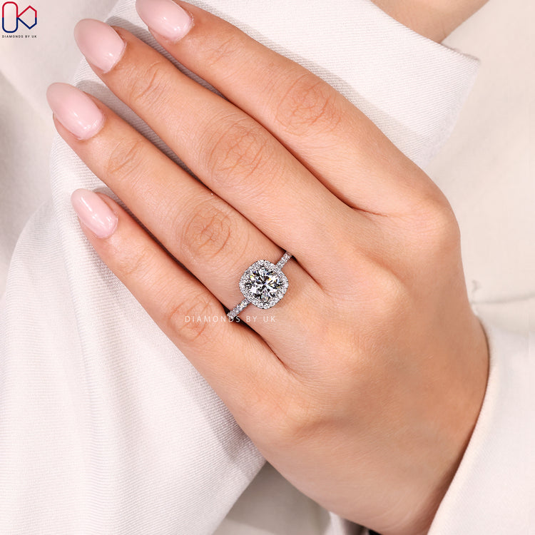 Round engagement ring with four claw prong setting.
