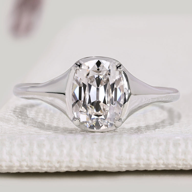 Cushion Old European cut diamond ring with solitaire style.
