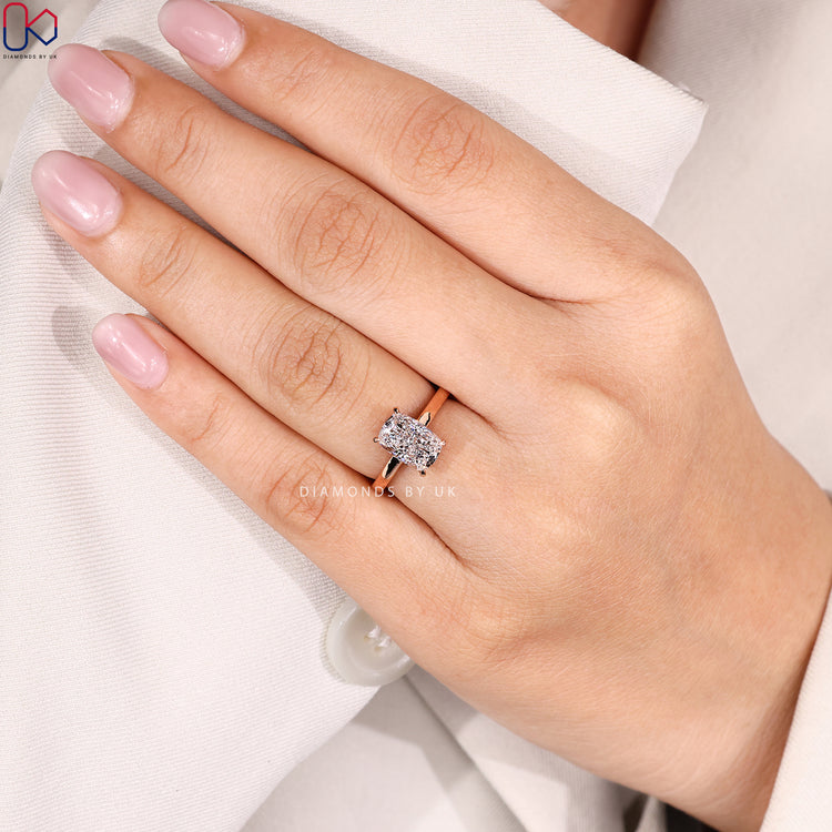 Cathedral cushion ring with four claw prong setting.
