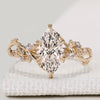 Marquise diamond ring with marquise and round side stones.
