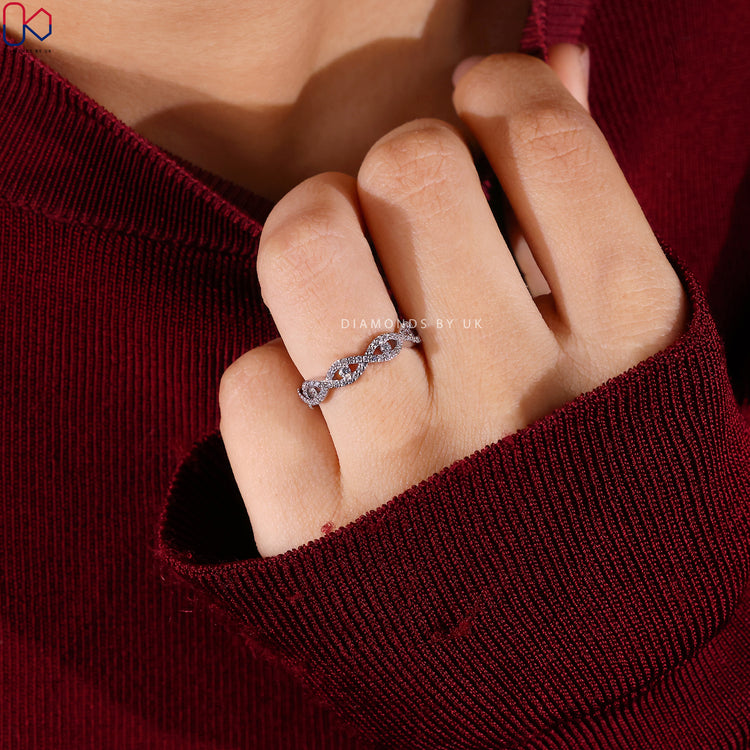 Lab grown round diamond band with twisted infinity style.
