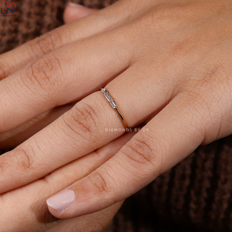 Baguette cut wedding band with three stone design.
