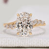 Oval diamond engagement ring with marquise side stones.