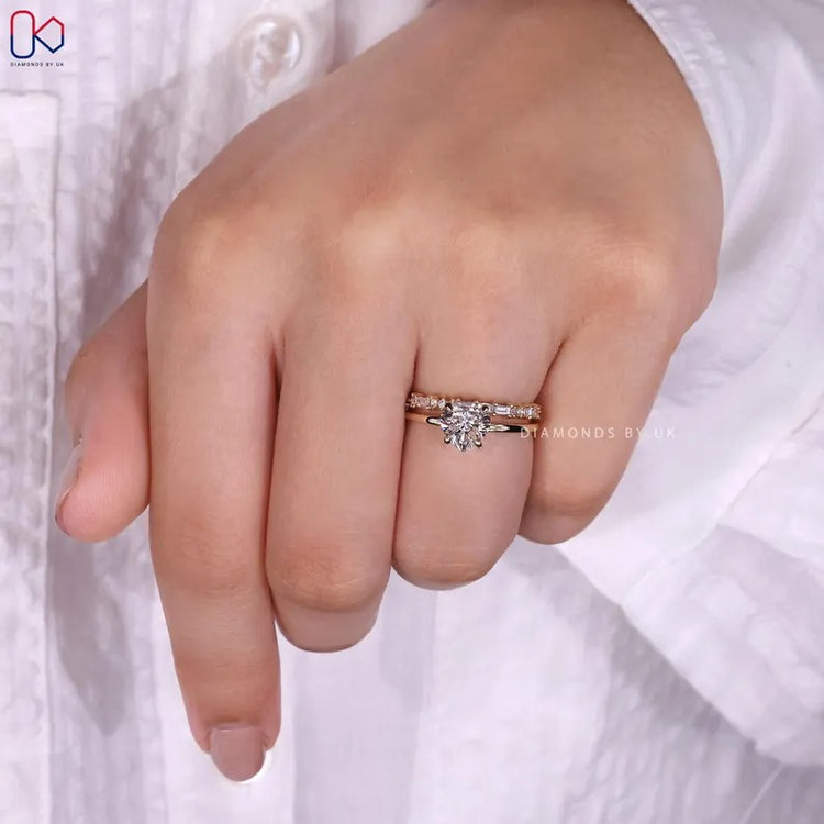 Hidden halo heart diamond ring with four claw setting.
