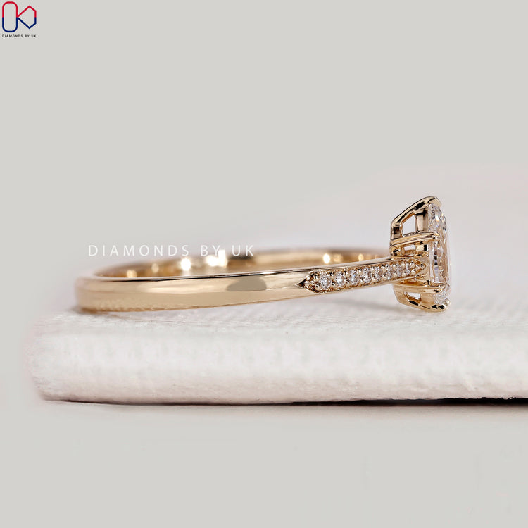 Handmade pear cut ring with tapered pavé style.