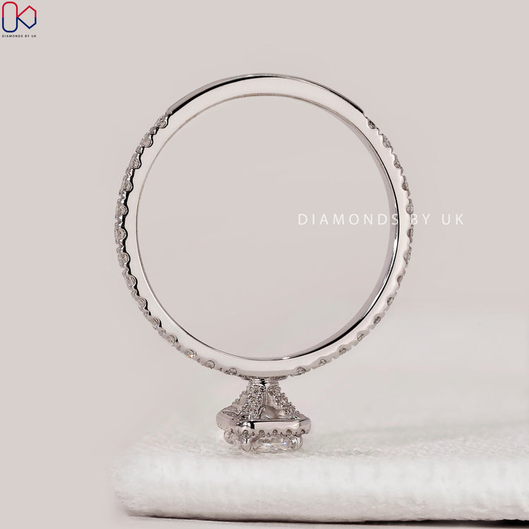 Halo radiant cut ring with four claw setting.