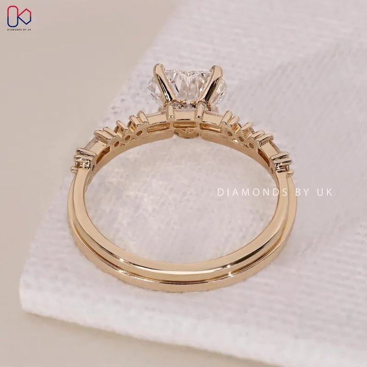 Handmade heart cut diamond ring with half eternity band.