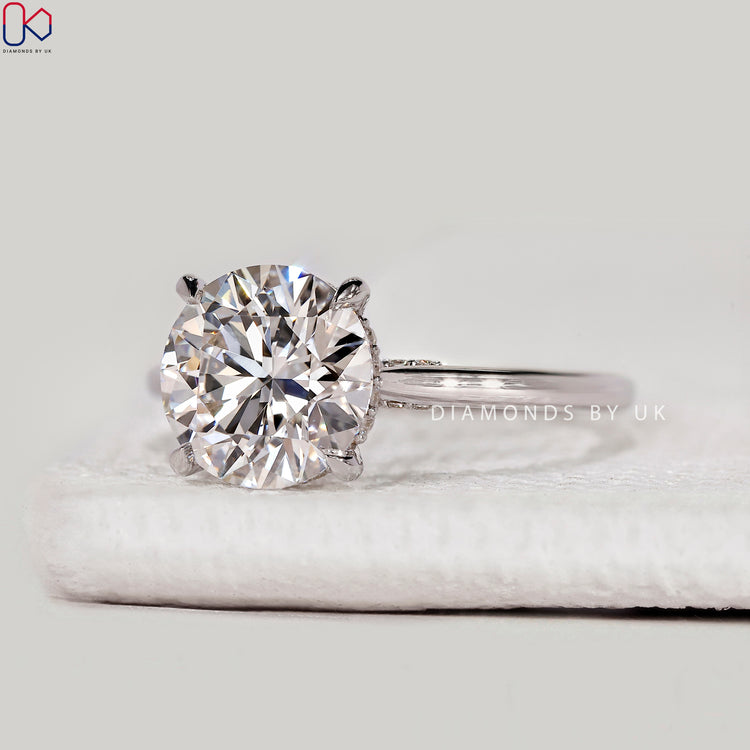 Round lab grown diamond ring with cathedral style.
