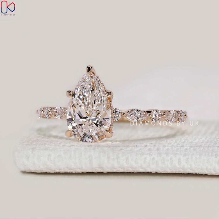 Pear cut lab grown diamond engagement ring.