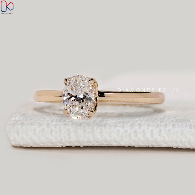 Handmade oval ring with four claw prong setting.