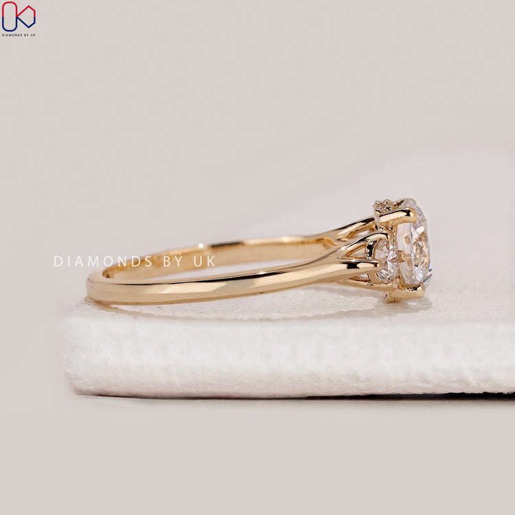 IGI Certified round cut three stone diamond ring.