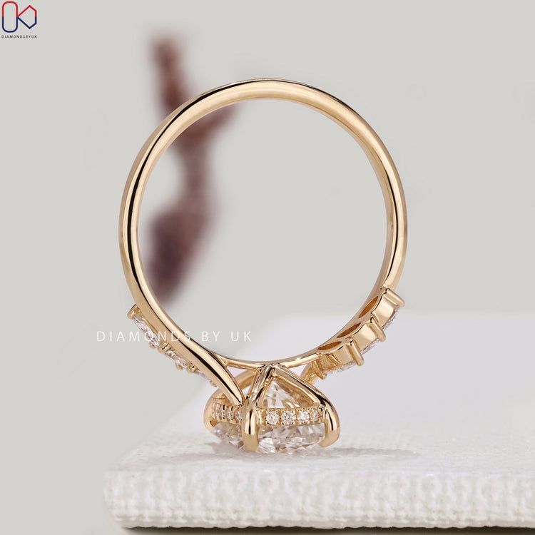 IGI certified oval diamond ring with marquise stones.
