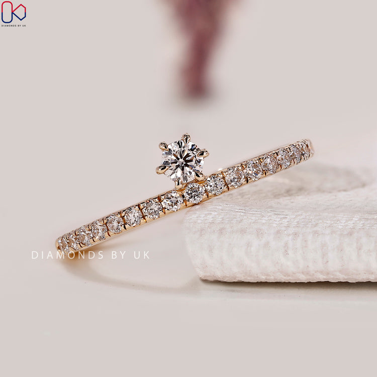 Round cut lab grown diamond band with pavé setting.
