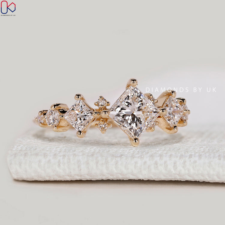 Princess cut lab grown diamond ring with cluster.