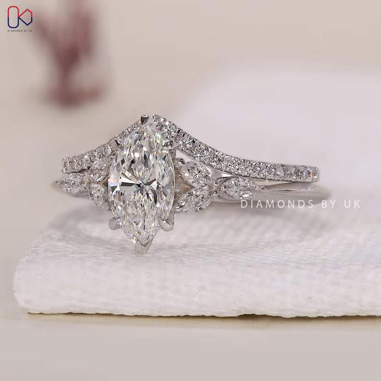 Marquise diamond ring with marquise side stones and band.